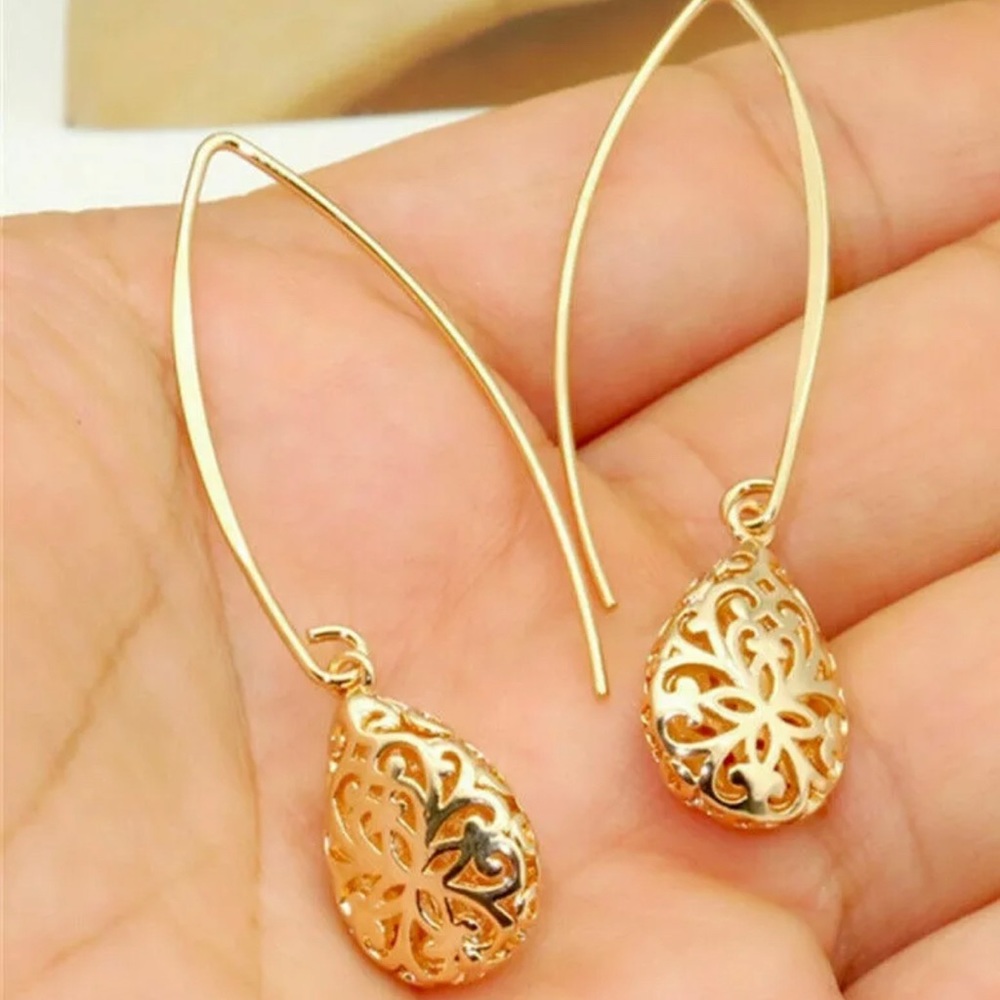 Romantic gold earrings measure 2 inches in length